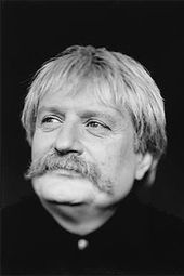 Karl Jenkins. Be sure to search on his image on the web. This is a very conservative portrait of a very colorful guy.