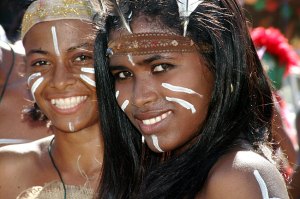 Dressed in Taino garb and makeup, two contemporary Dominican girls demonstrate that these were real people with families and traditions. Each year, we celebrate an American hero who killed most of the Taino people.