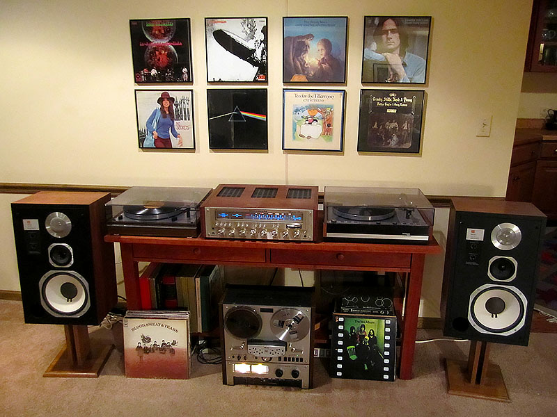 Here's a wonderful example of a 1970s stereo system (but few people owned two turntables). This image comes from a collector of 1970s stereo equipment (click on the link for more pictures and some stories). You are looking at: a Marantz 2330b receiver, a Thorens TD-165 turntable, a Thorens TD-126 turntable, JBL L96 speakers, and an Akai GX-266D reel to reel tape deck.